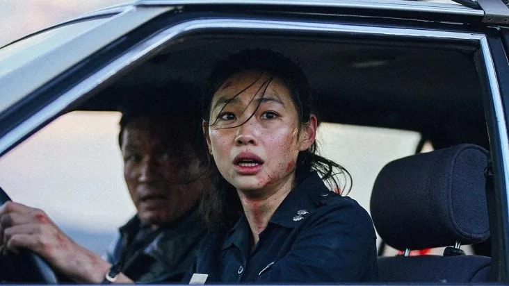 HOPE film still showing a police officer in a patrol car