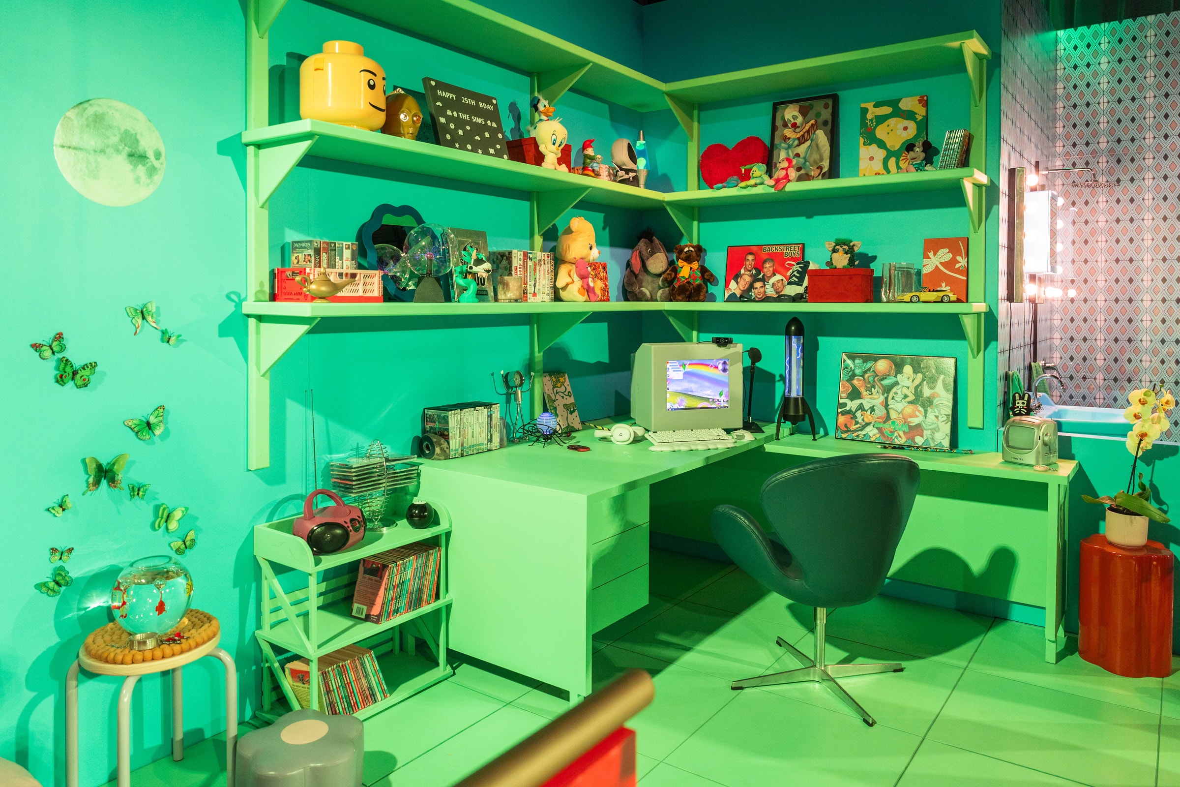 The Y2K bedroom set, with shelves of collectables and a desk