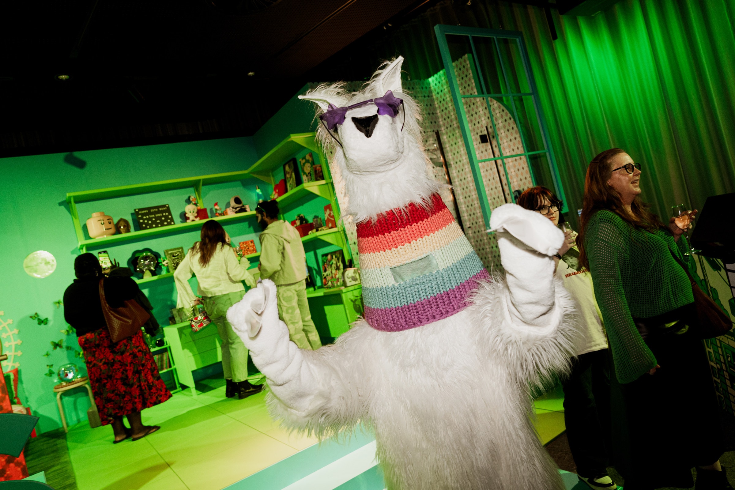 The llama mascot dancing with guests